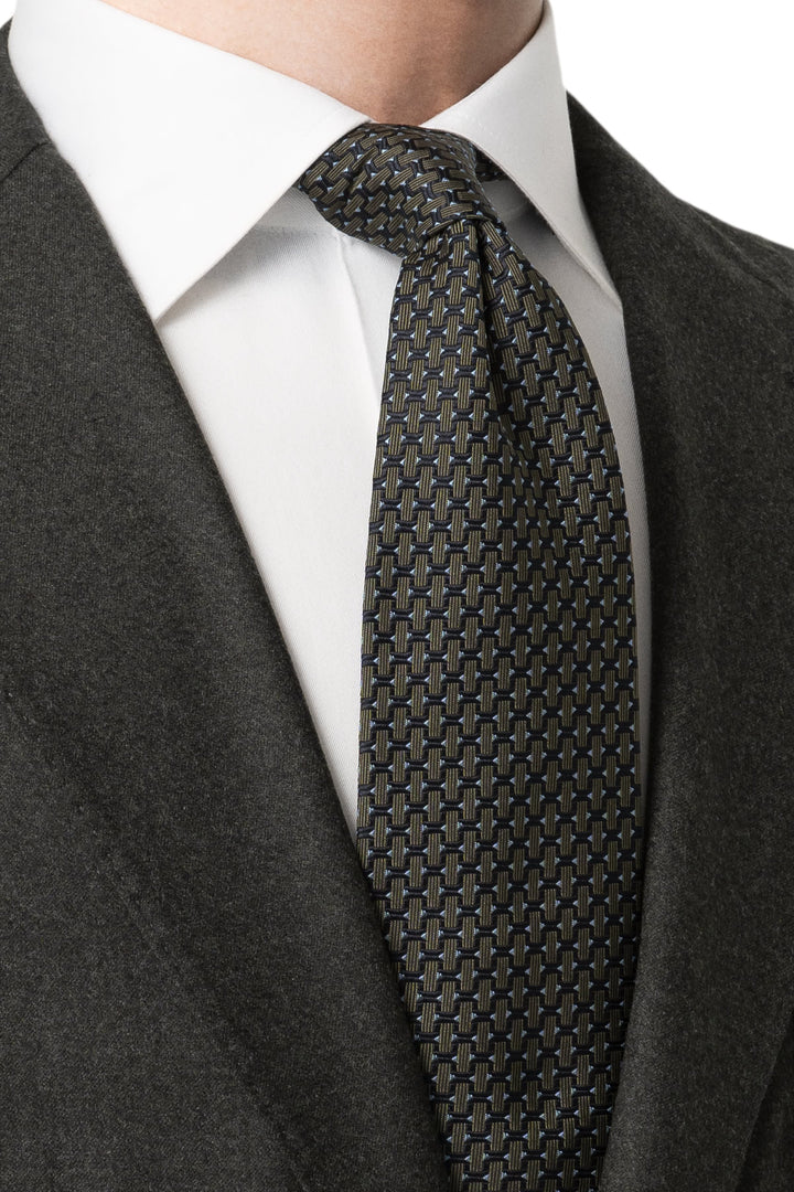 Close-up of a multicolored geometric-patterned Eton silk tie for men - Valérie Simon