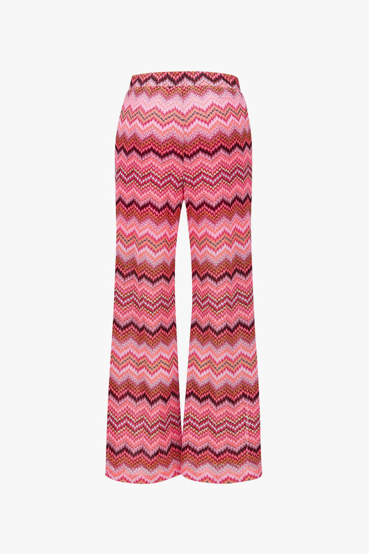 Pantalon Tafari tricoté avec motifs en zigzag colorés, jambe évasée et ceinture élastique, design féminin et tendance.