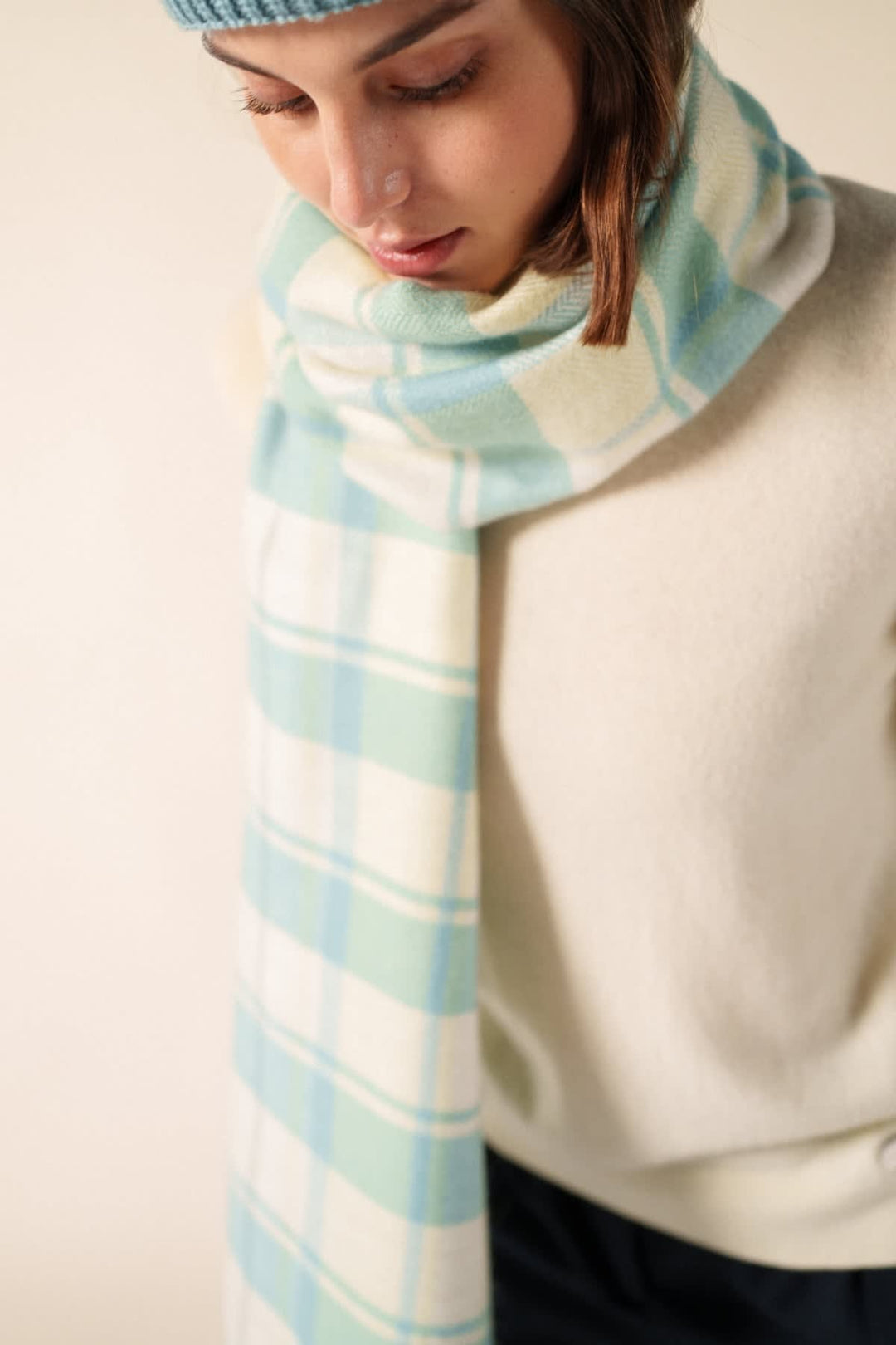 Side view of a beige Saint James checkered scarf with geometric patterns for women - Valérie Simon