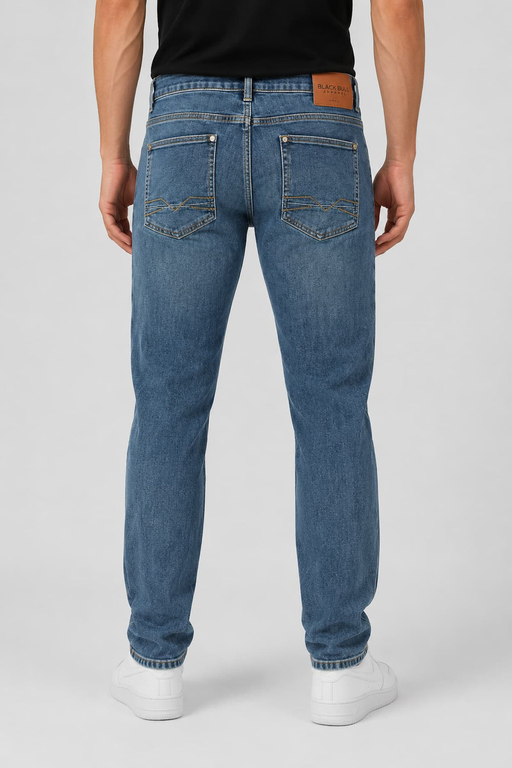 Rear view of Black Bull men's black stretch straight-leg jeans with visible back label - Valérie Simon