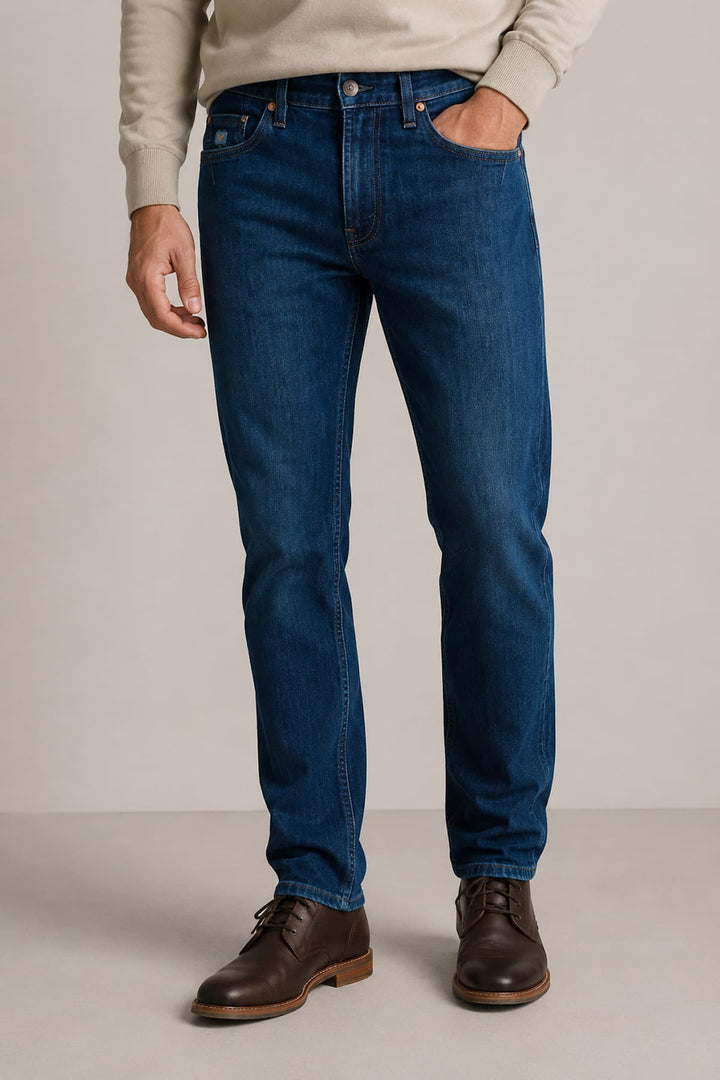 Side view of Black Bull stretch jeans for men in black with exposed seams - Valérie Simon