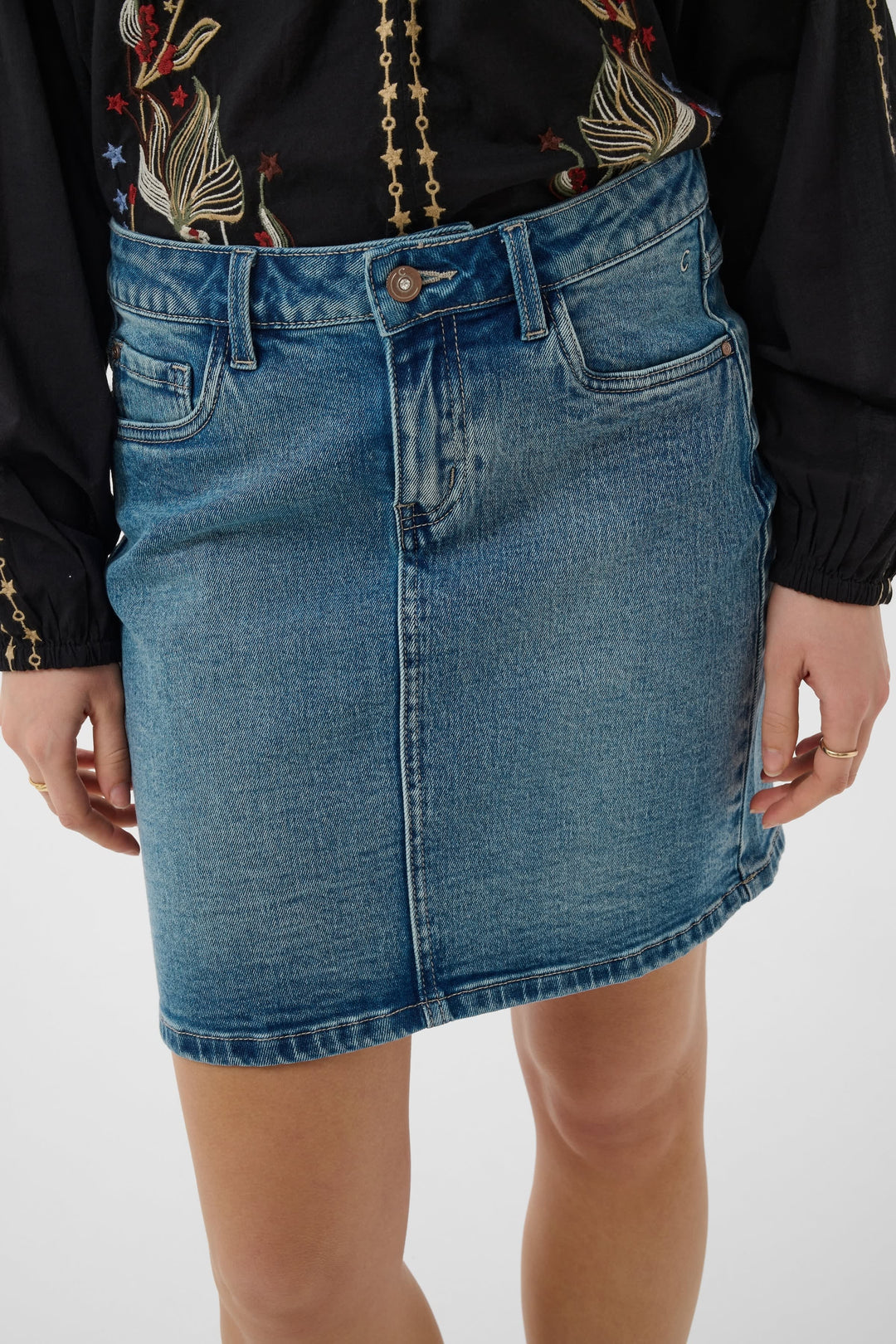 Side view of a blue denim skirt with buttons Cream - Valérie Simon