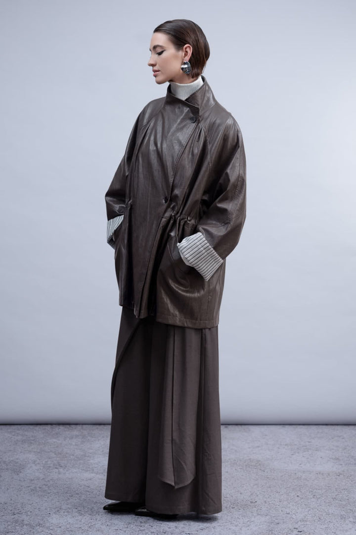 Front view of the Haako black faux leather coat for women with a wide collar - Valérie Simon