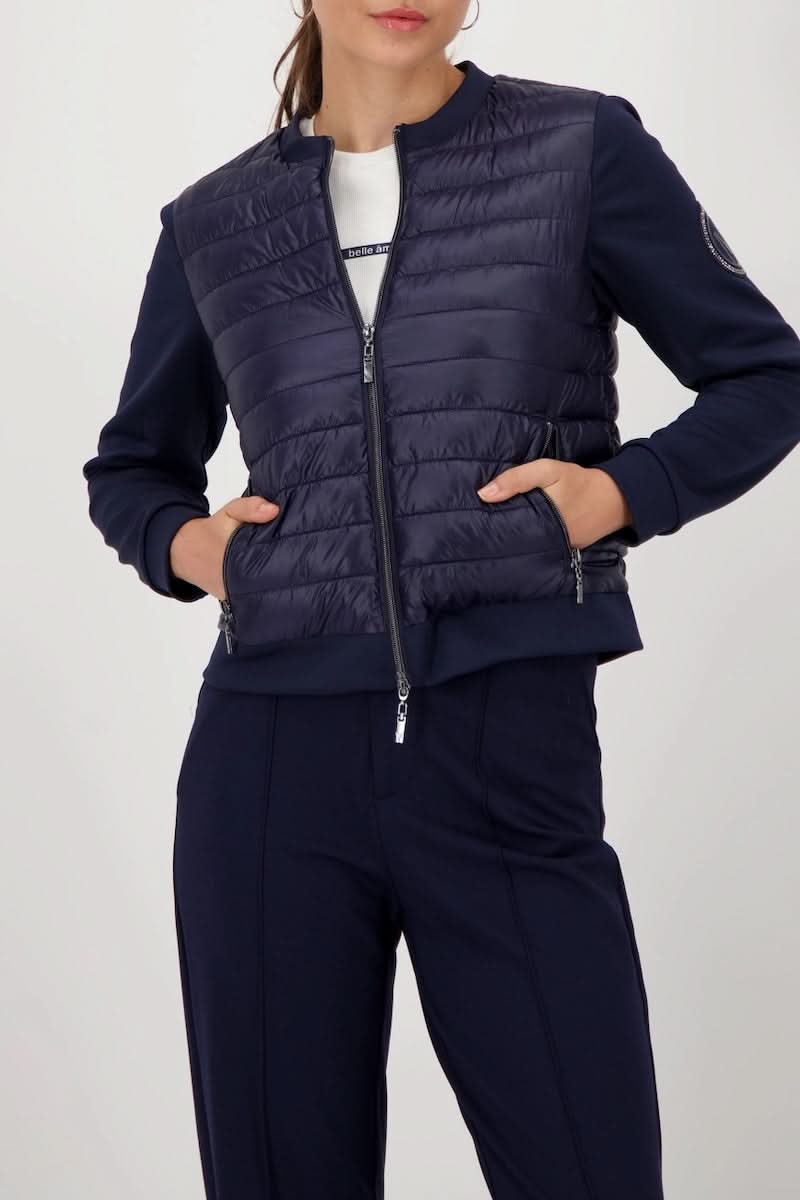 Veste matelassée bimatière à fermeture éclair pour un style urbain et sportif, décris moi le produit en français.