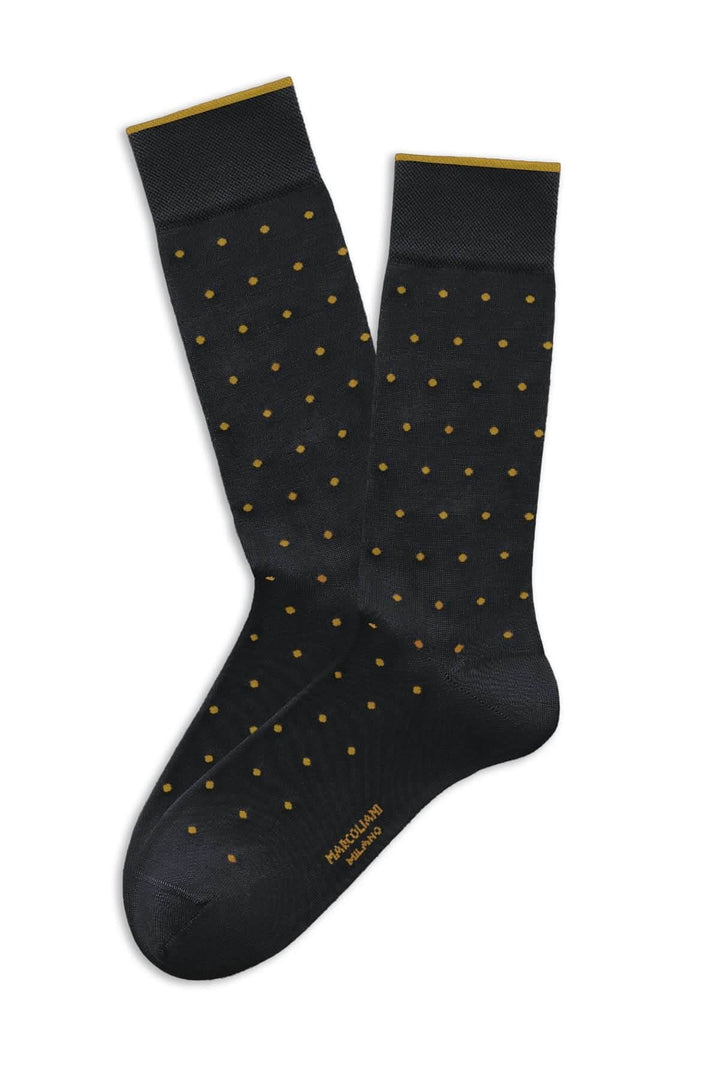 Bas à pois noirs élégants avec motifs dorés, coupe mi-haute et bord-côte élastiqué.