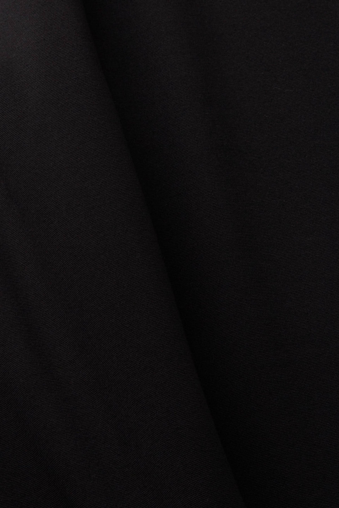 Tissu noir en jersey point pour legging, douceur et confort, parfait pour une coupe slim.