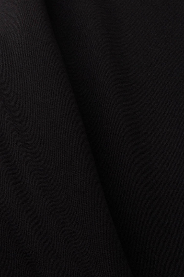 Tissu noir en jersey point pour legging, douceur et confort, parfait pour une coupe slim.