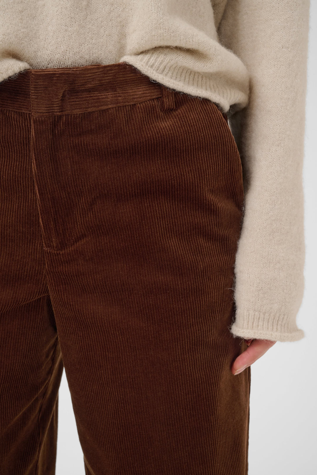 Front view of brown corduroy chino pants for women Part Two