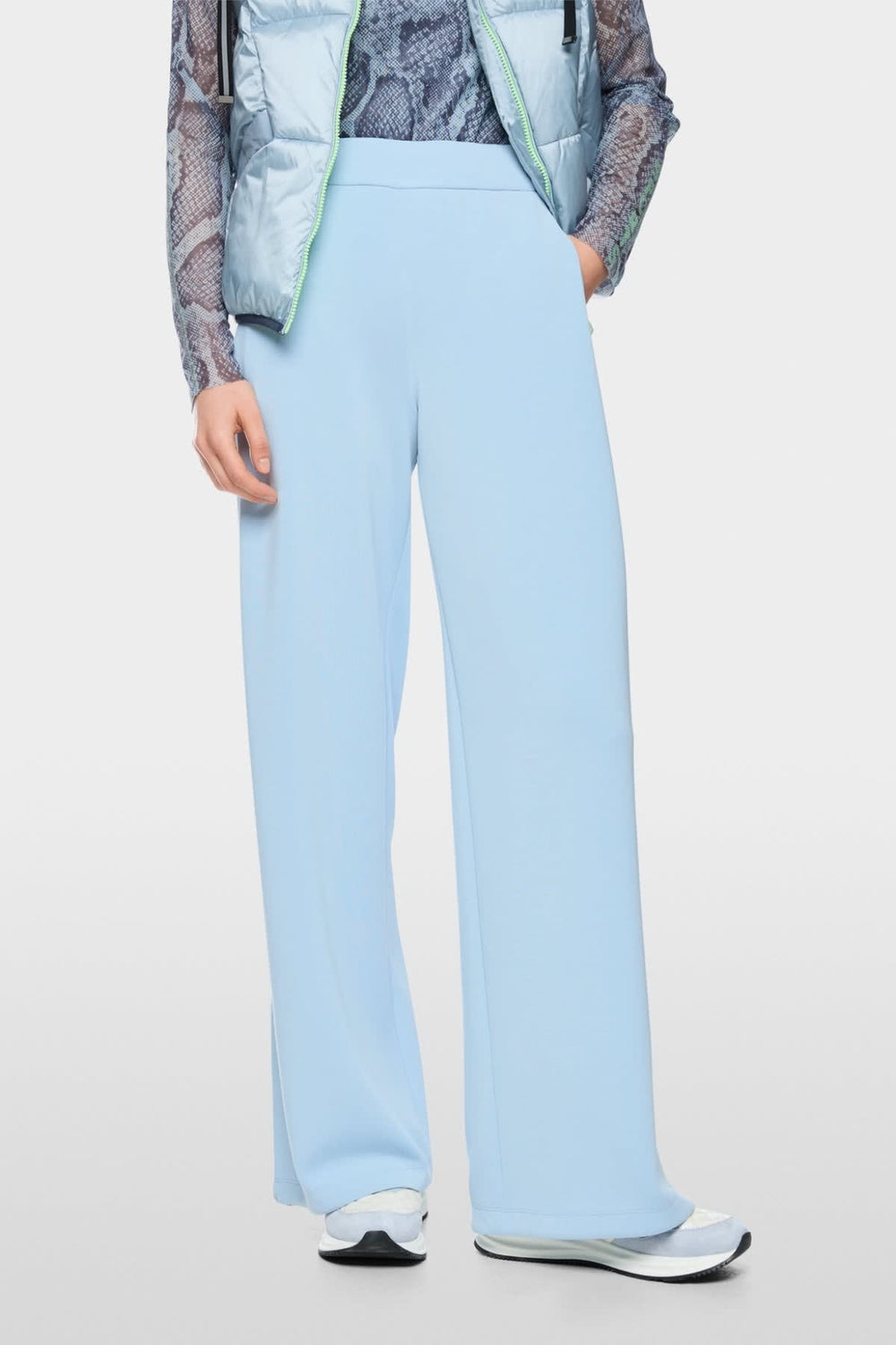 Side view of Wedi Marc Cain women's black pants with striped details by Valérie Simon