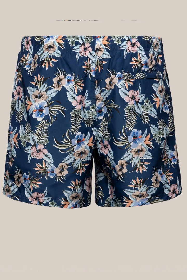 Short de bain fleuri à imprimé floral sur fond bleu, en tissu polyester à séchage rapide.