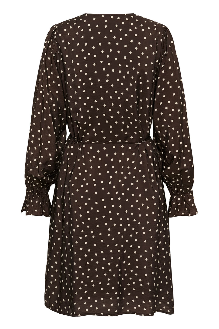 Front view of a short, polka-dot Kaffe dress for Black women with a tied belt - Valérie Simon