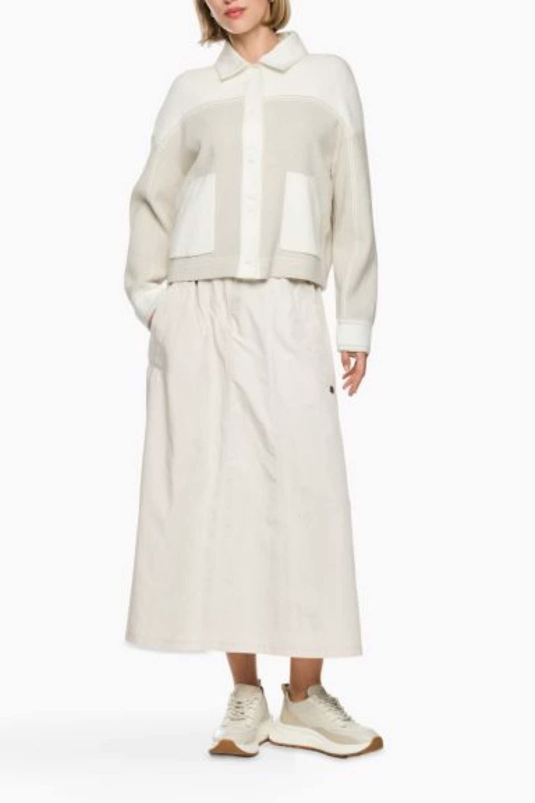 Side view of a beige textured knit overshirt by Marc Cain for women, featuring button details - Valérie Simon