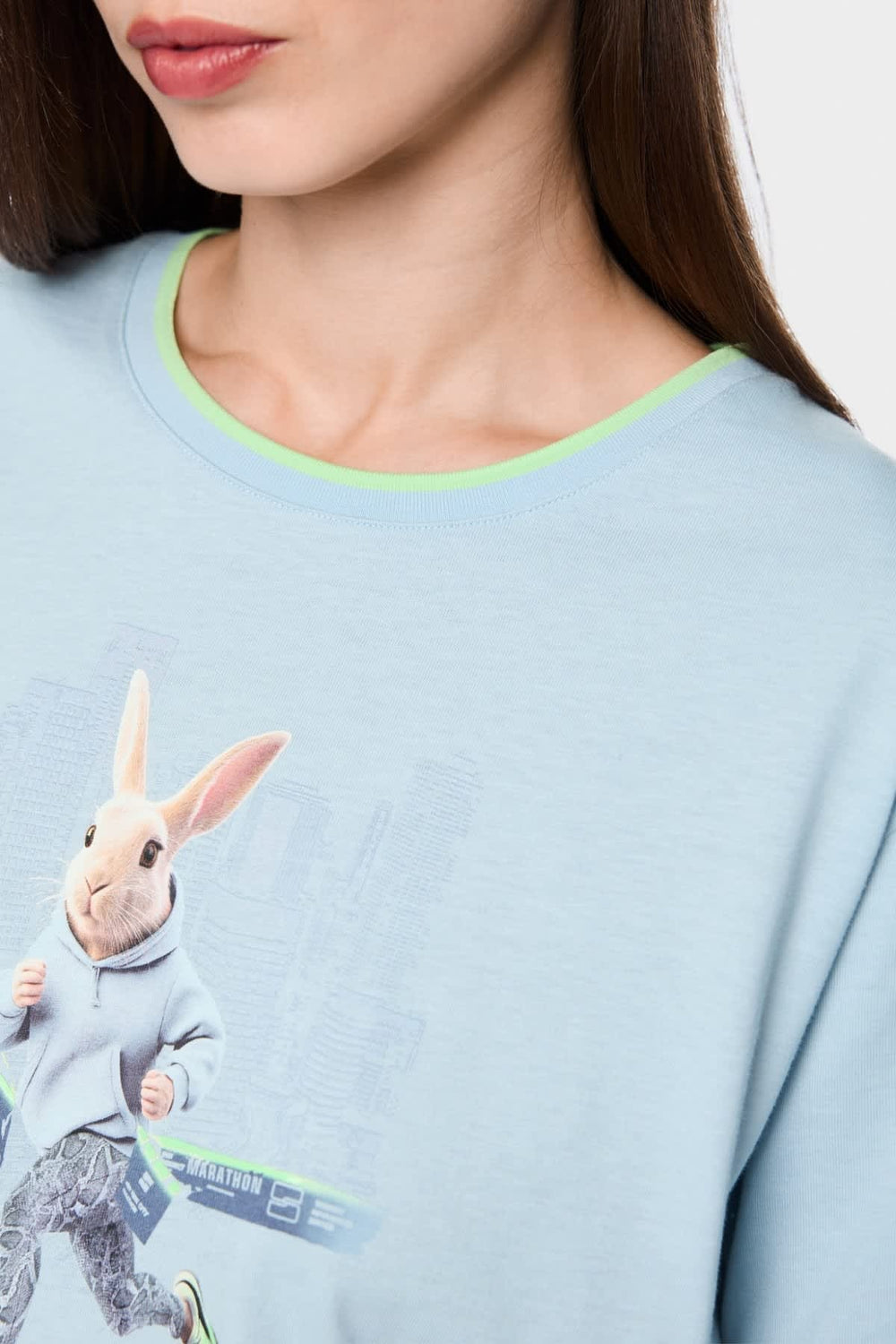 Front view: Marc Cain white women's T-shirt with rabbit print and colorful rabbit detail - Valérie Simon