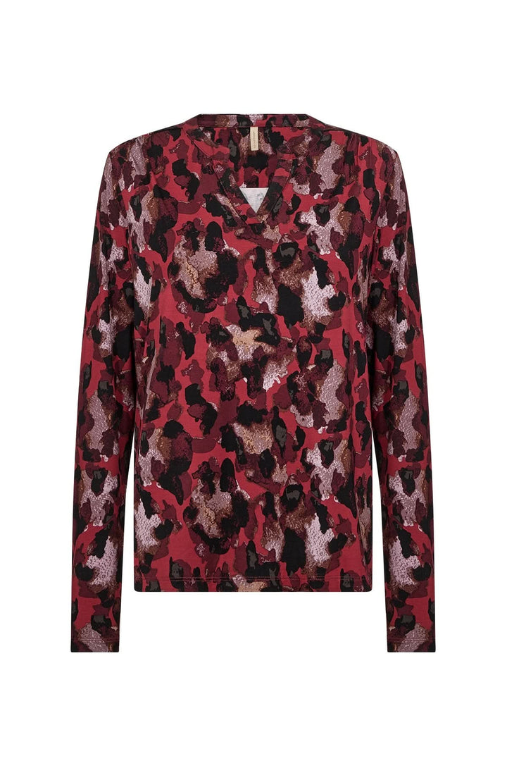 Blouse imprimée avec motif abstrait en rouge et noir, encolure V, manches longues, style féminin.