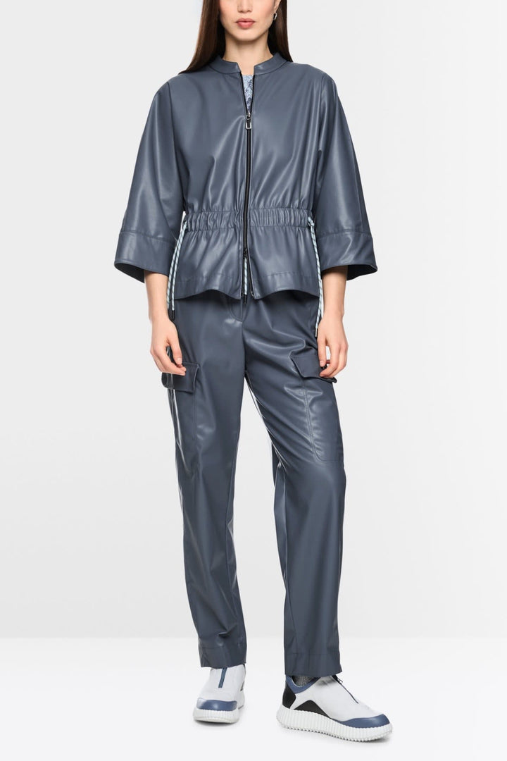 Rear view of a black faux leather Marc Cain jacket for women—pocket detail by Valérie Simon