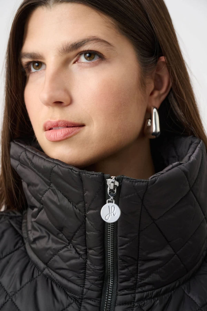 Front view of a blue Joseph Ribkoff quilted sleeveless jacket for women with a high collar - Valérie Simon