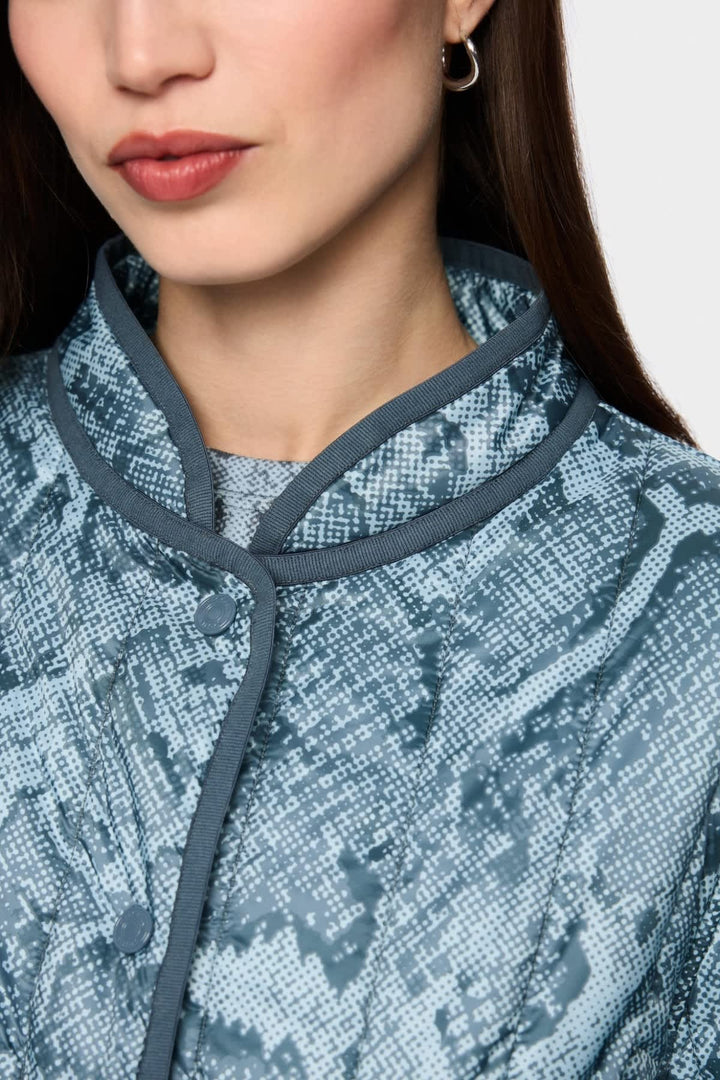 Front view of Marc Cain reversible quilted jacket for women in red with stitching details - Valérie Simon