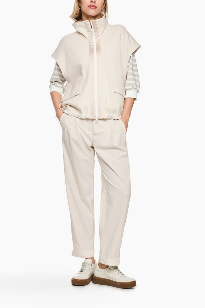 Front view of a beige Marc Cain sleeveless jacket with a high collar and gold buttons - Valérie Simon
