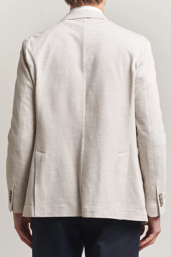 Vue de face veston homme Eton à motif chevrons gris avec boutons noirs - Valérie Simon