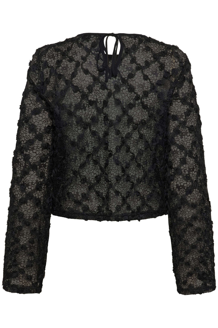 Blouse Rosie en dentelle florale à manches longues avec motifs floraux et coupe droite élégante. Idéale pour un look moderne et féminin.