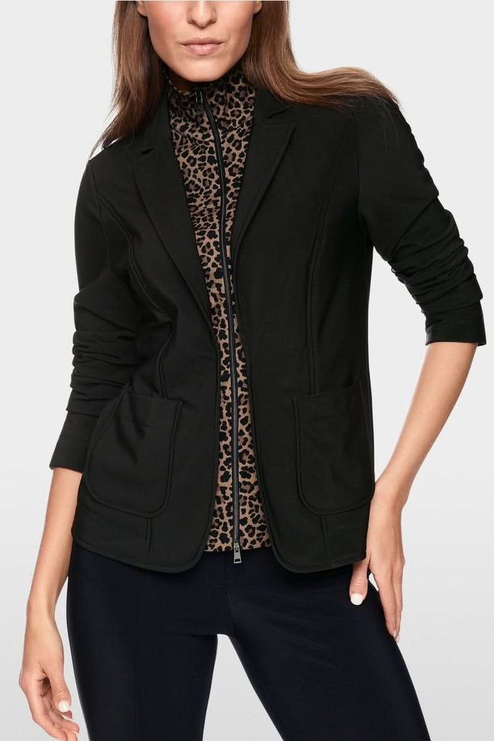 Veste avec supperposition élégante et féminine, coupe ajustée, matière extensible, motif léopard, style décontracté ou professionnel.