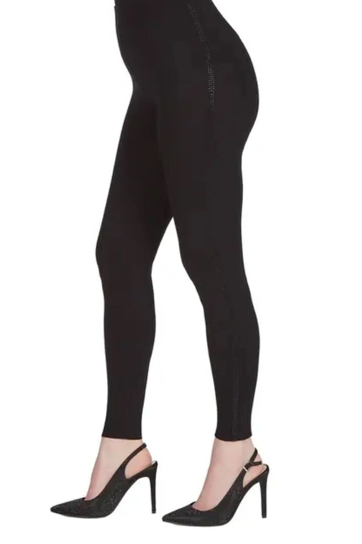 Legging noir avec bande brillante, chic et confortable, parfait pour tous les looks.