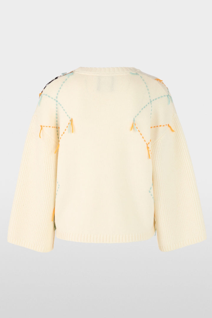 Chandail à motif losanges et accents léopard, vue arrière. Coupe ample, col rond, motifs texturés, détails modernes pour l'hiver.