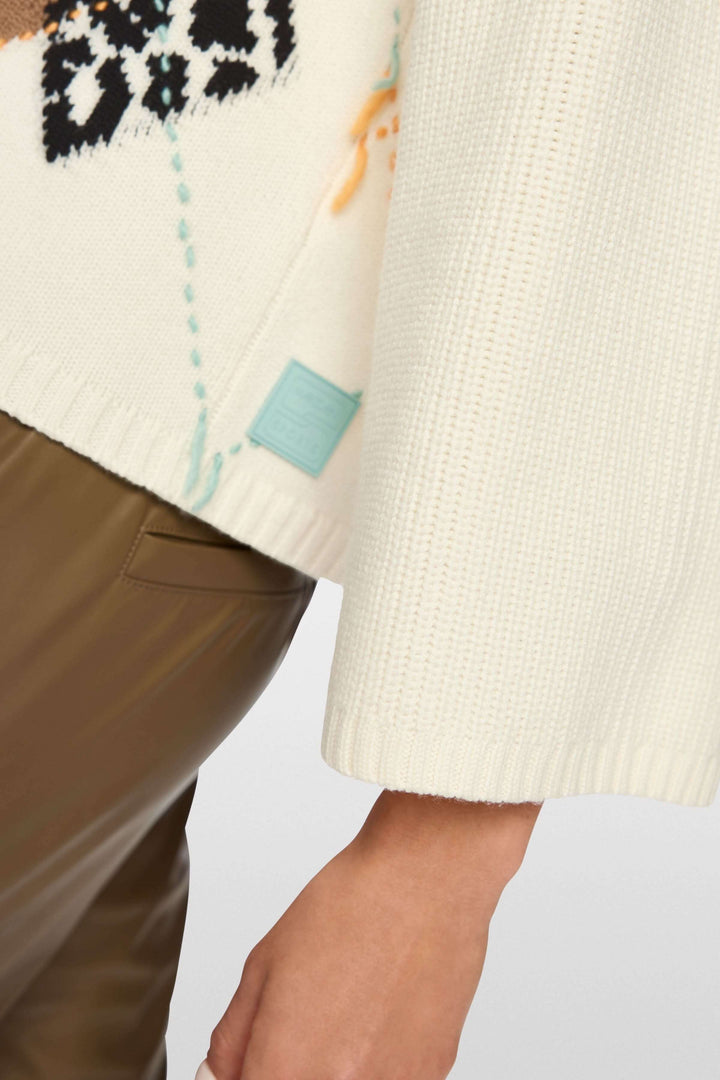 Chandail à motif losanges et accents léopard, moderne et confortable, détail manche et motif unique, parfait pour la saison froide.