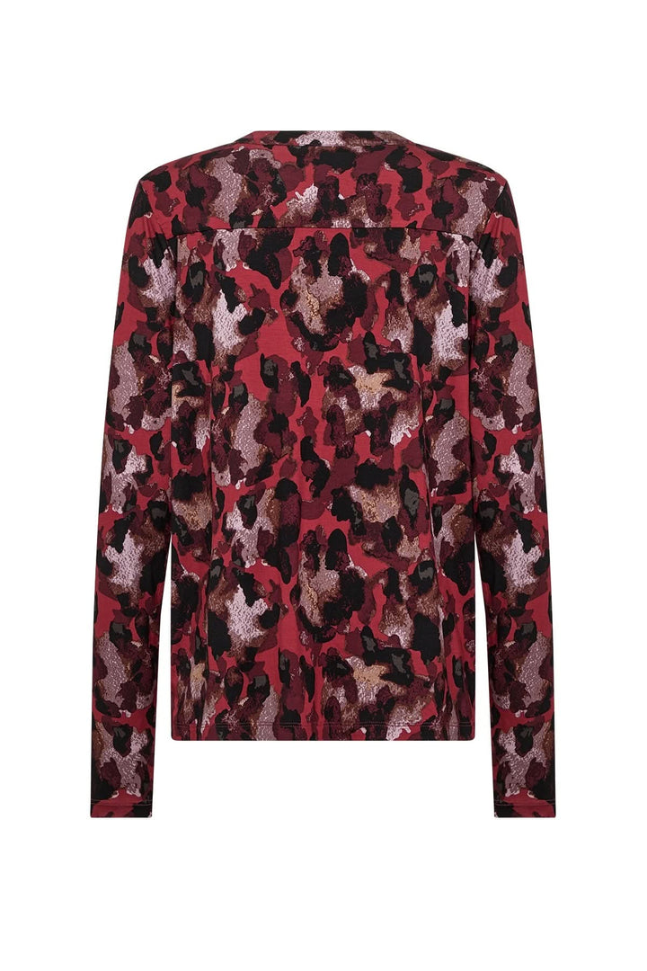 Blouse imprimée au dos, motif abstrait rouge et noir, avec encolure ronde et manches longues.