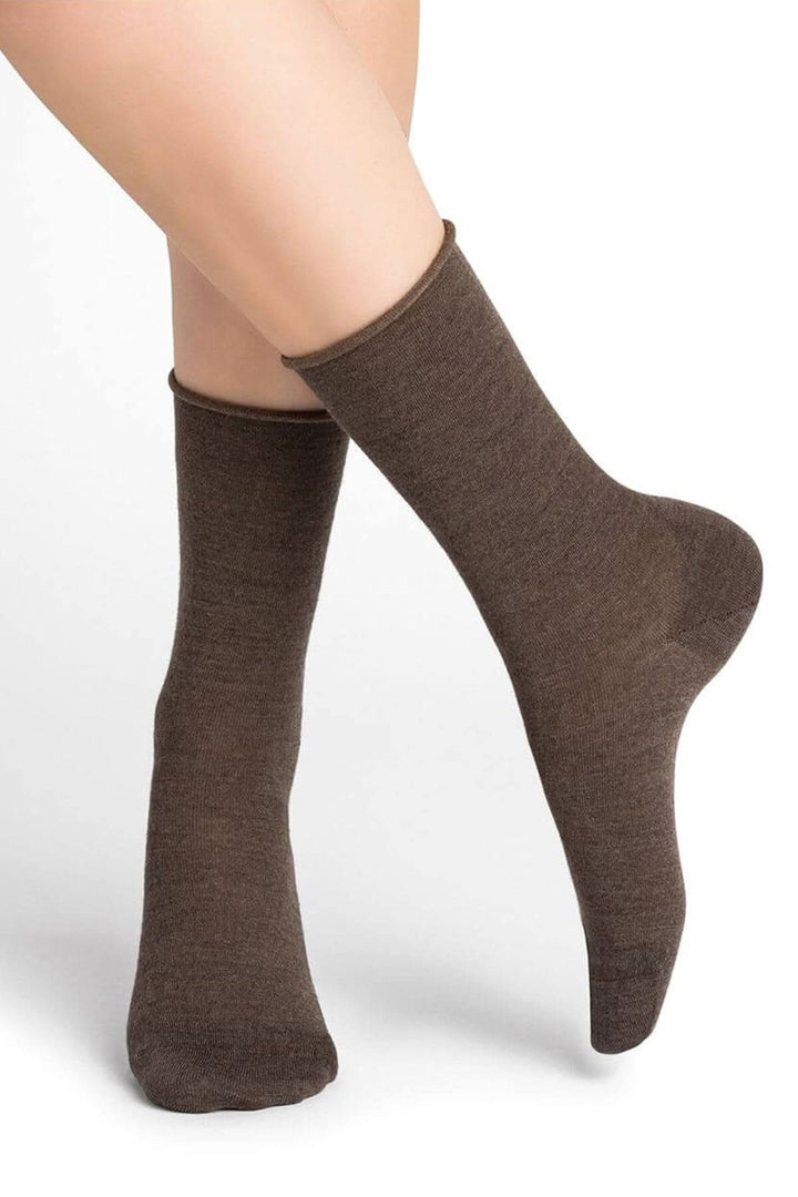 Chaussettes en laine mérinos marron, confortables et fines, offrant chaleur et douceur pour les femmes.