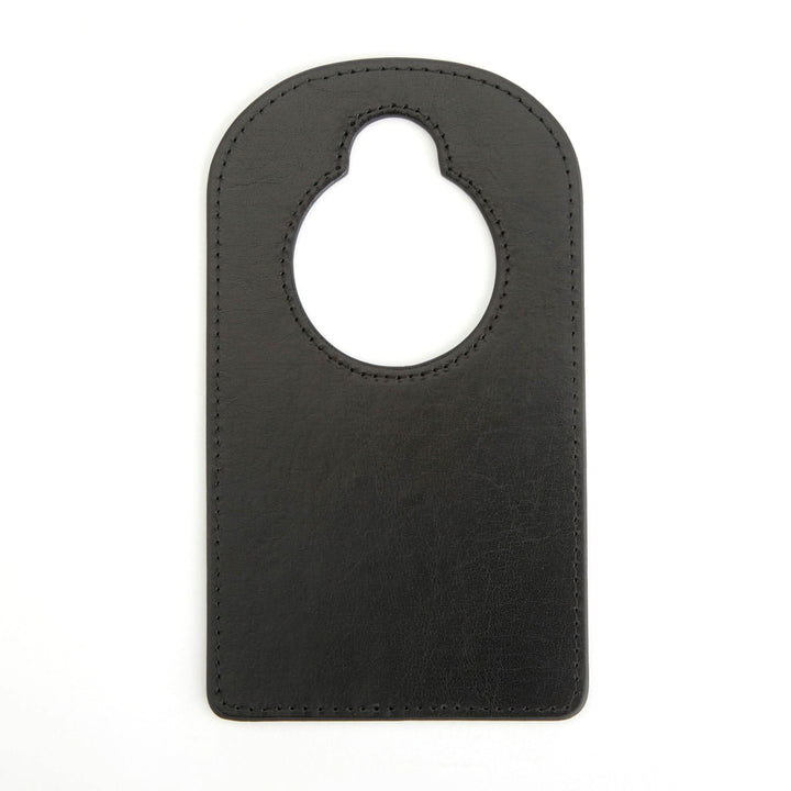 Black leather door knob hanger, handcrafted for personalized nursery or bedroom décor, featuring a classic monogram option.