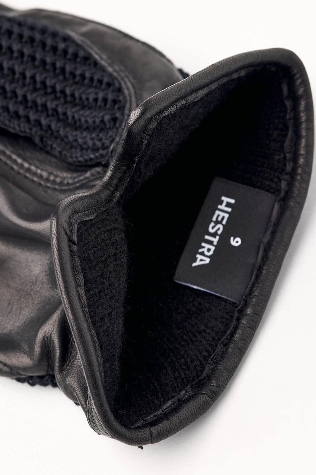 Intérieur gant en cuir Hestra, avec doublure en laine noire et étiquette de taille 9.