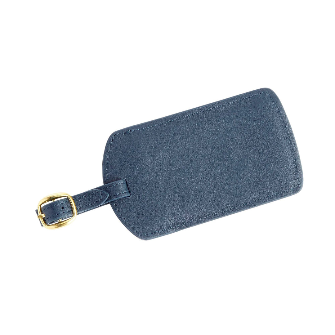 Navy blue handcrafted leather luggage tag with gold tone hardware and adjustable strap for stylish travel.