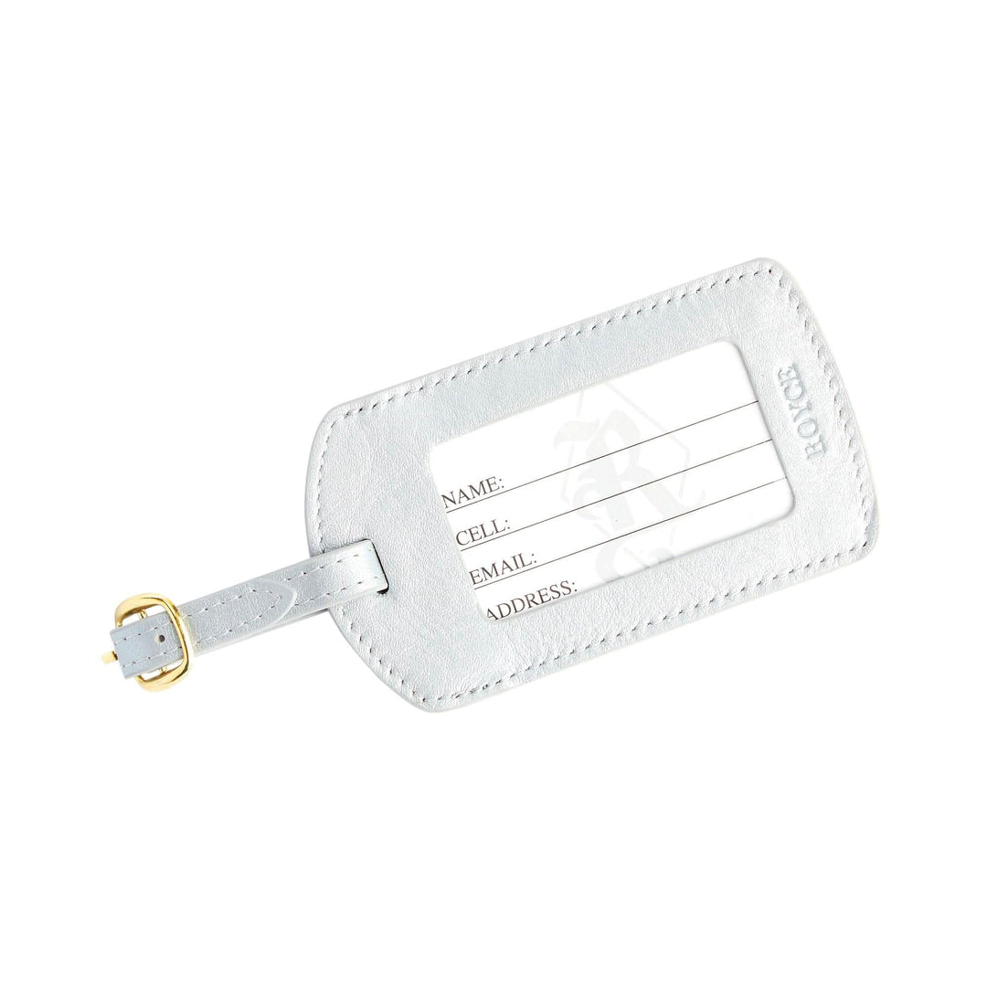 Handcrafted leather luggage tag with gold tone hardware and personalization options for travel enthusiasts.