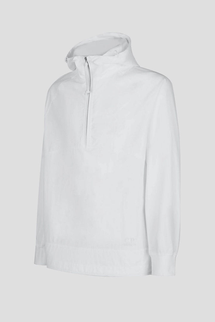 Hoodie Dyshell en blanc avec demi-fermeture zippée et logo, fabriqué en nylon bi-stretch résistant à l'eau.
