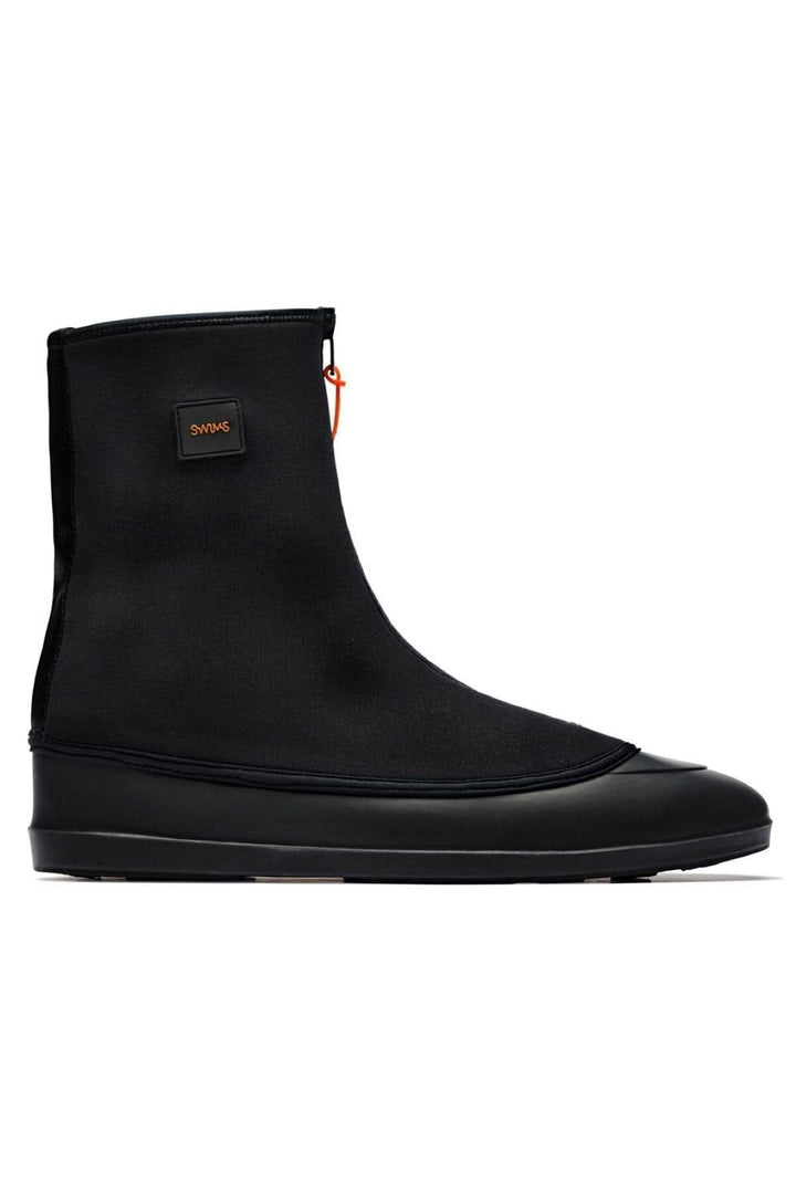 Bottes Le Mobster en néoprène noir, imperméables avec semelle en caoutchouc naturel, idéales pour les journées humides.