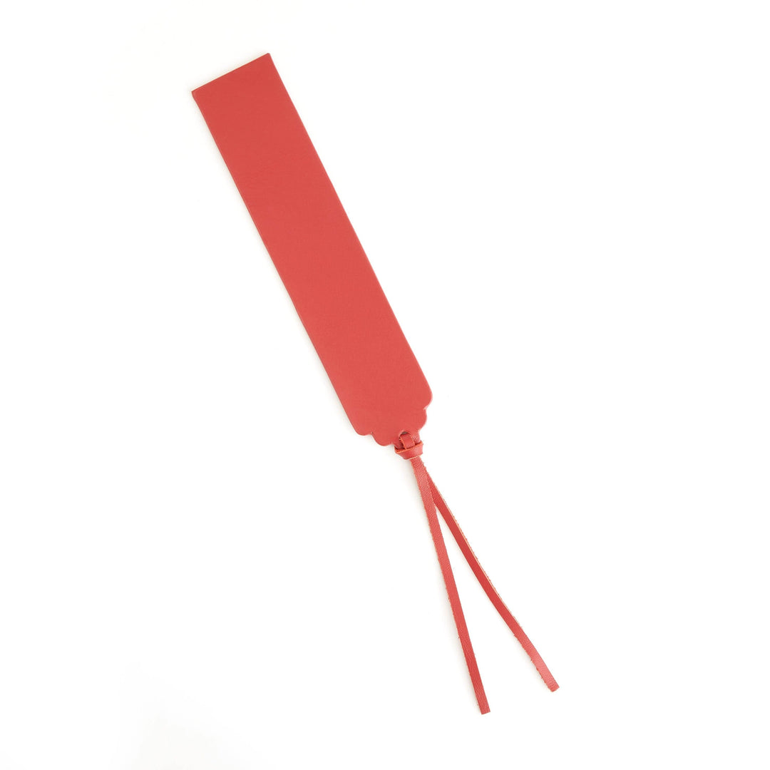 Handmade red leather bookmark with decorative tassel, perfect for personalized gifting and elegant page marking.