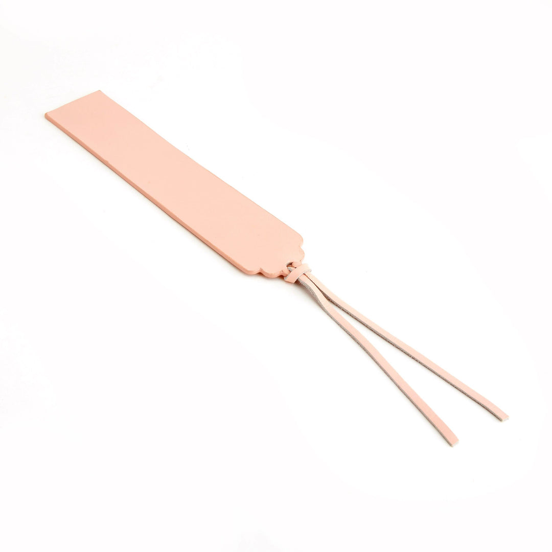 Handmade pink leather bookmark with elegant design and personalization option for monogramming.