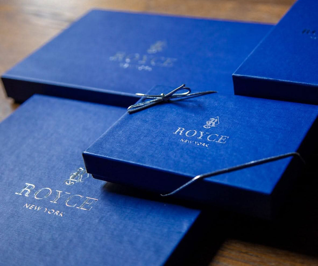 Elegant blue gift boxes from ROYCE New York, perfect for premium leather products and personalized gifts.
