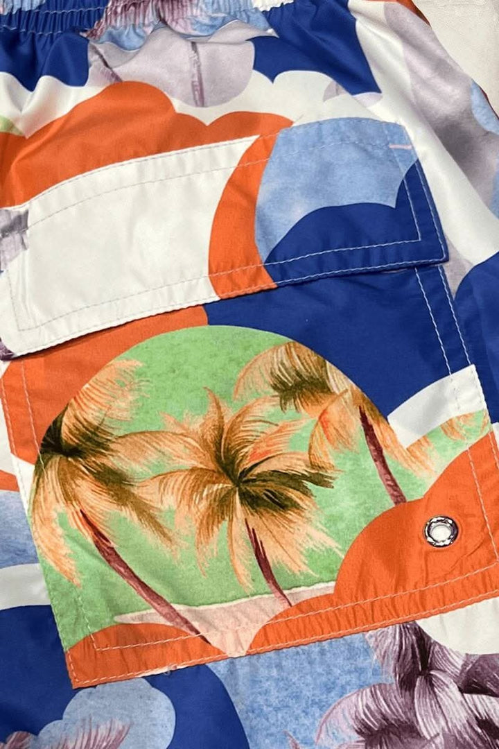 Maillot de bain coloré avec motif tropical de palmiers sur tissu en polyester, parfait pour l'été.