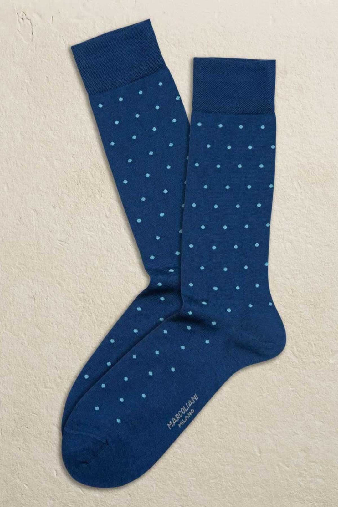 Chaussettes italiennes Marcoliani bleu marine avec motifs de pois, 72% coton, 28% polyester.