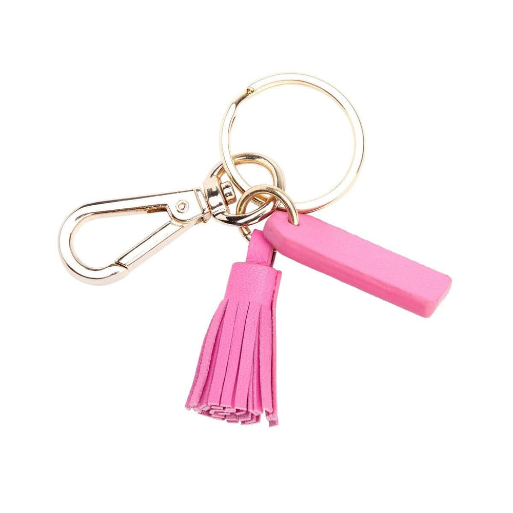 Mini tassel key fob in pink with goldtone hardware, perfect for organizing keys stylishly.