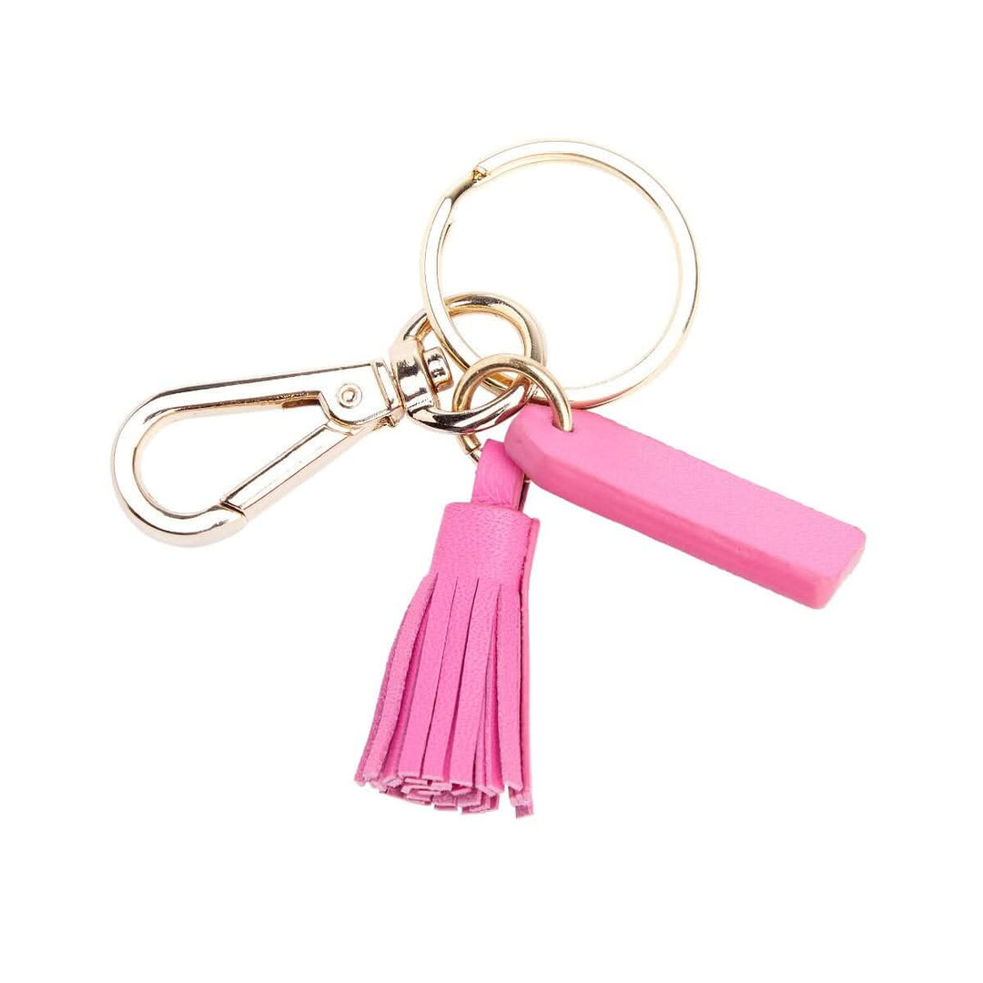 Charming pink mini tassel key fob with goldtone hardware, perfect for organizing keys stylishly.