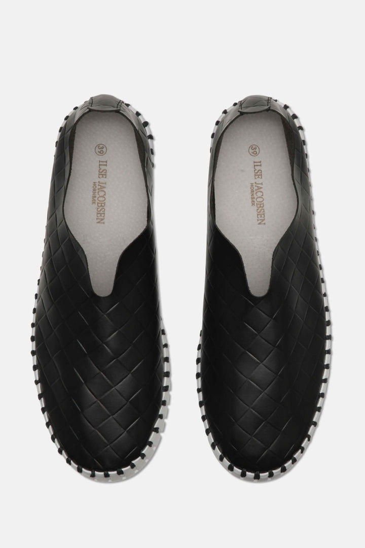 Mocassin tulipe noir en cuir verni avec tige en microfibre et semelle en caoutchouc, confort et style.