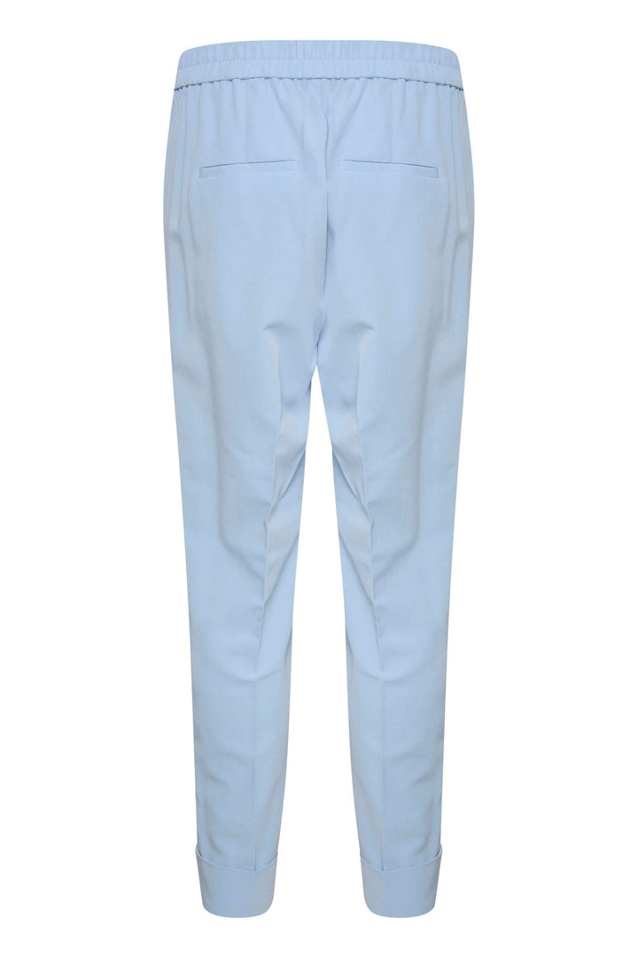 Pantalon à revers Naxa, jambe fuseau, taille élastique, poches, couleur bleu clair.