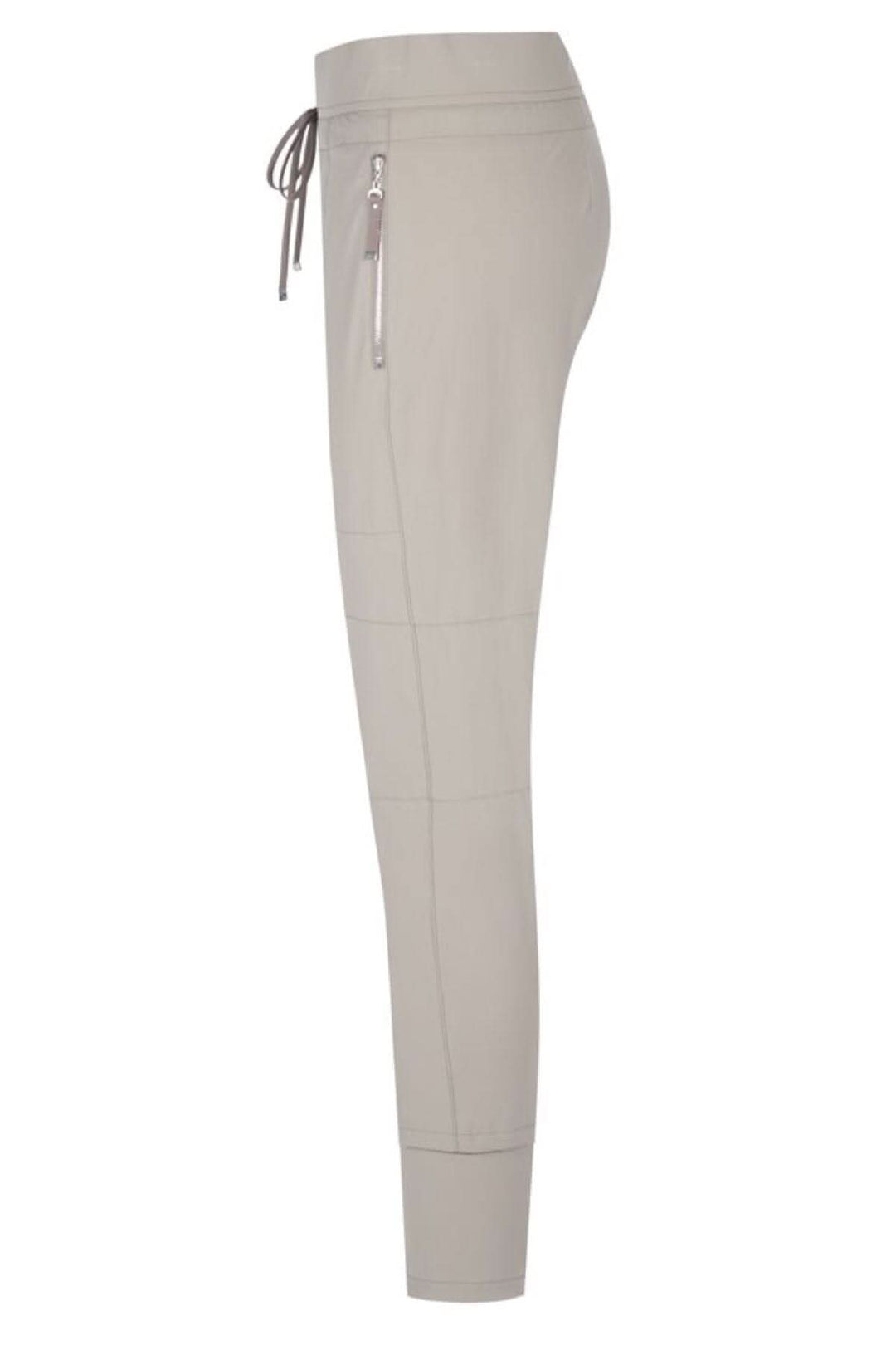 Pantalon Candy élégant en beige avec cordon de serrage et poches zippées, parfait pour un look décontracté.