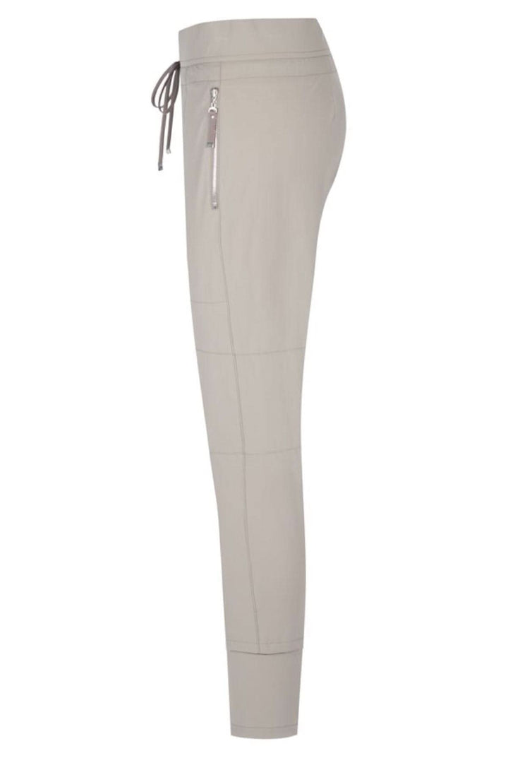 Pantalon Candy élégant en beige avec cordon de serrage et poches zippées, parfait pour un look décontracté.