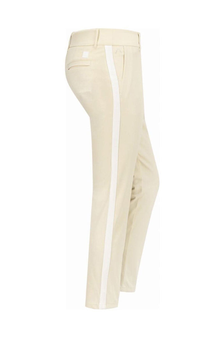 Pantalon Lucy beige, coupe slim 7/8 avec rayure contrastée sur le côté, confortable et élégant.