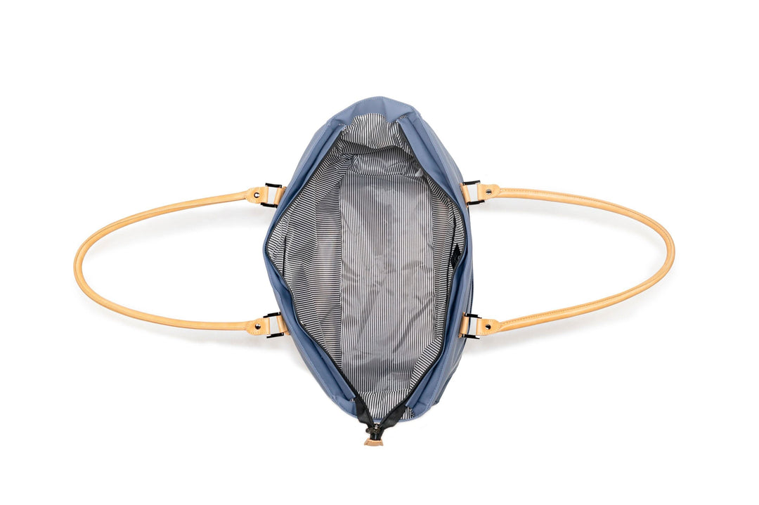 Open PKG Georgian 33L tote bag showing weather-resistant interior and stylish handles.