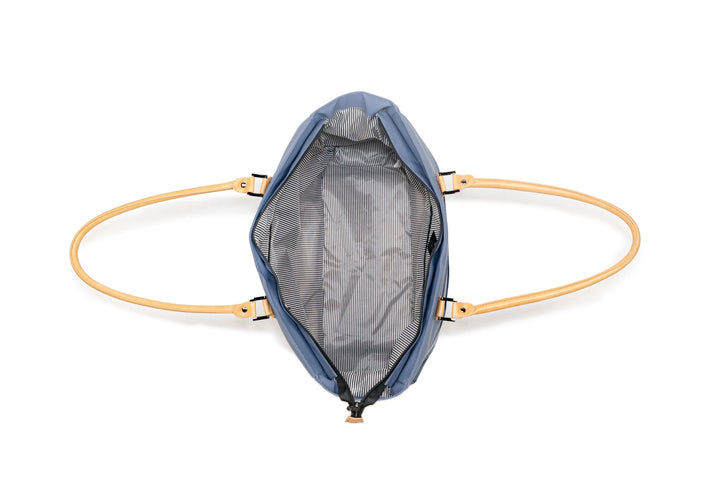 Open PKG Georgian 33L tote bag showing weather-resistant interior and stylish handles.